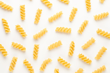 Italian twisted pasta fusilli isolated on white background. Fusilloni, rotini.