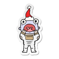 sticker cartoon of a alien gasping in surprise wearing santa hat