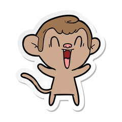 sticker of a cartoon laughing monkey