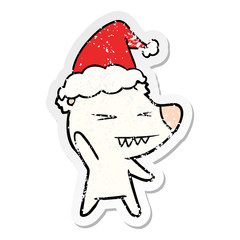angry polar bear distressed sticker cartoon of a wearing santa hat