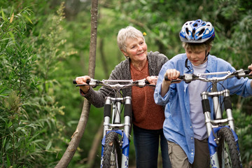 Grandmother and grandson cycling together