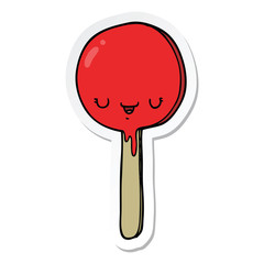 sticker of a cartoon candy lollipop