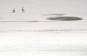 Winter scene on frozen Antholz Lake, Val Pusteria, Italy.
