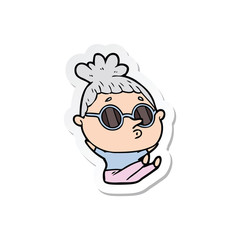 sticker of a cartoon woman wearing sunglasses