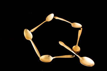 Letter "Q" made of spoons