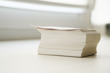 A stack of notes is on the windowsill in the office