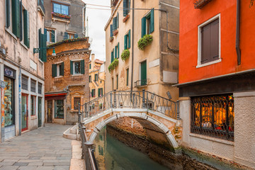 Fototapeta na wymiar Canal and historic buildings in Venice, Italy