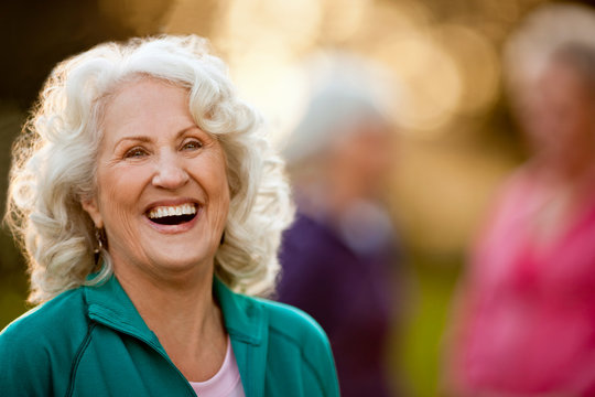 Smiling Senior Woman Standing Outdoors