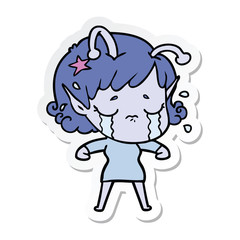 sticker of a cartoon crying alien girl