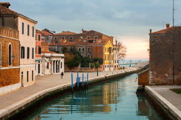 Fototapeta na wymiar Canal and historic buildings in Venice, Italy