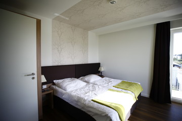 Fototapeta na wymiar Bright comfortable modern bedroom
