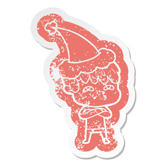 cartoon distressed sticker of a curious man wearing santa hat