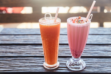 A glass of traditional Indian drink Faluda and fresh papaya juice.