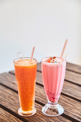 A glass of traditional Indian drink Faluda and fresh papaya juice.