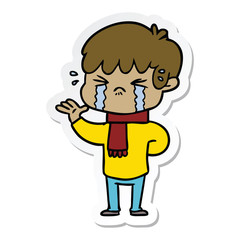 sticker of a cartoon boy crying