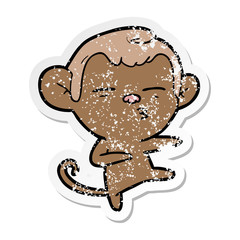 distressed sticker of a cartoon suspicious monkey