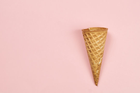 Empty Waffle Ice Cream Cone On Pastel Pink Background