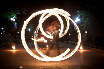 Amazing fire show dance. Fire dancers playing with flame