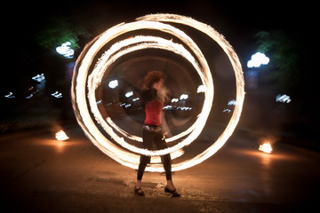Amazing fire show dance. Fire dancers playing with flame