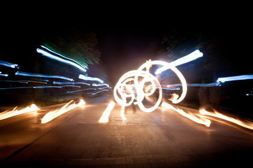 Amazing fire show dance. Fire dancers playing with flame
