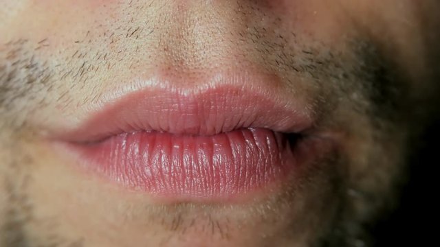 Close-up of chewing mouth. Man chewing gum