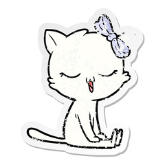distressed sticker of a cartoon cat with bow on head