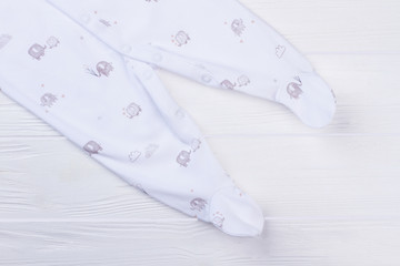 Baby footed sleepwear pajama feet with printed elephants.