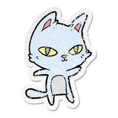 distressed sticker of a cartoon cat staring