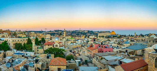 Sunset view of Jerusalem dominated by golden cupola of the dome of the rock, Israel