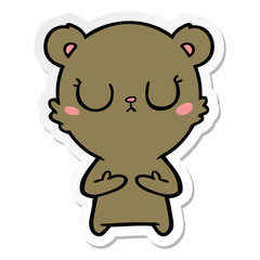 sticker of a peaceful cartoon bear cub
