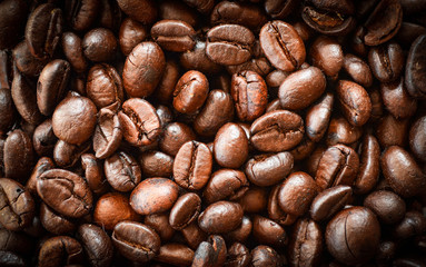 Close up of Coffee beans roasted texture background - top view
