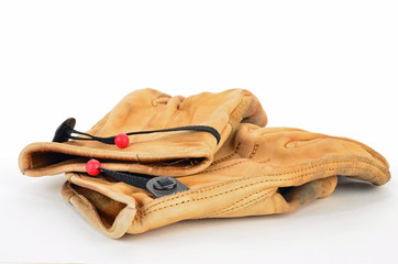 Pair of well-used leather work gloves against white BG