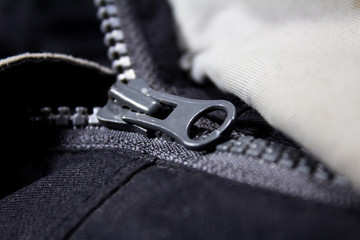 zip on the sides of the jacket in dark gray tones