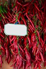 Fresh red chillies on the grocer bench