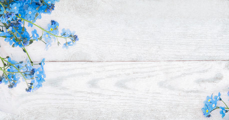 Rustic Spring wooden background with forget-me-nots flowers
