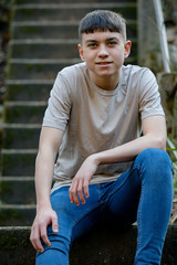 Fototapeta premium Teenage boy outside on a bright Spring day