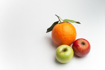 Apples and orange fresh from the garden isolated white background