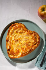 Fresh baked apple pie on a white table