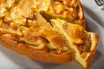 Fresh baked apple pie on a white table