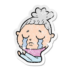distressed sticker of a cartoon crying woman