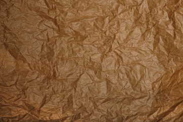 Crumpled parchment or baking paper for baking culinary and confectionery products as natural background. 