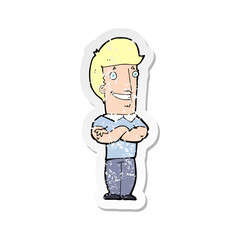 retro distressed sticker of a cartoon man with folded arms grinning