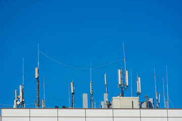 Panel antenna of GSM DCS UMTS LTE bands and radio unit are as part of communication equipment of...