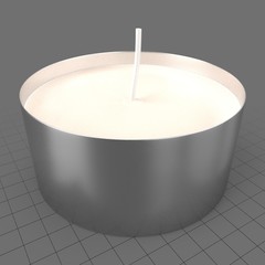 Small candle in metal holder