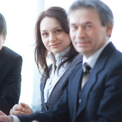Fototapeta na wymiar portrait of a professional business team sitting behind a Desk .
