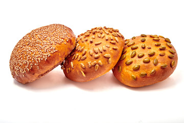 Hamburger buns with seeds isolated on white background