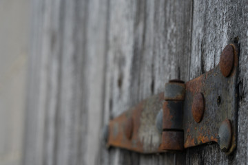 rusty aged iron hinge weathered gray wood door