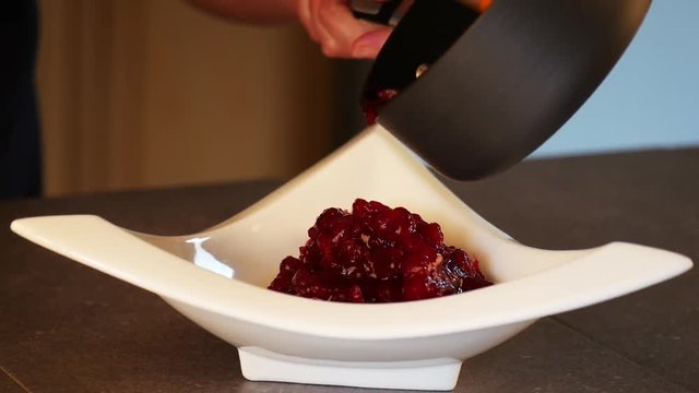 Pouring Cranberry Sauce Into Dish