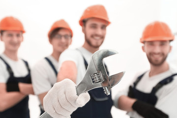 closeup. the wrench in the hands of the builders