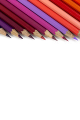 color pencils on wooden background